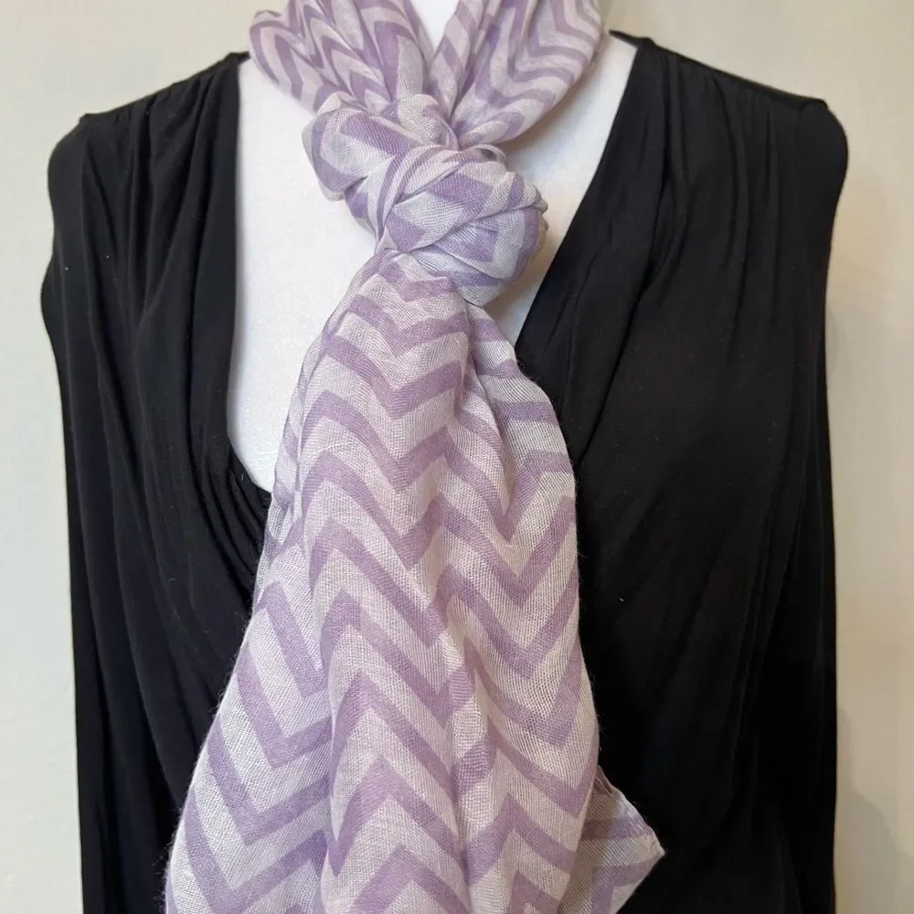 NWOT lavender and white infinity scarf. Adds flair to any outfit